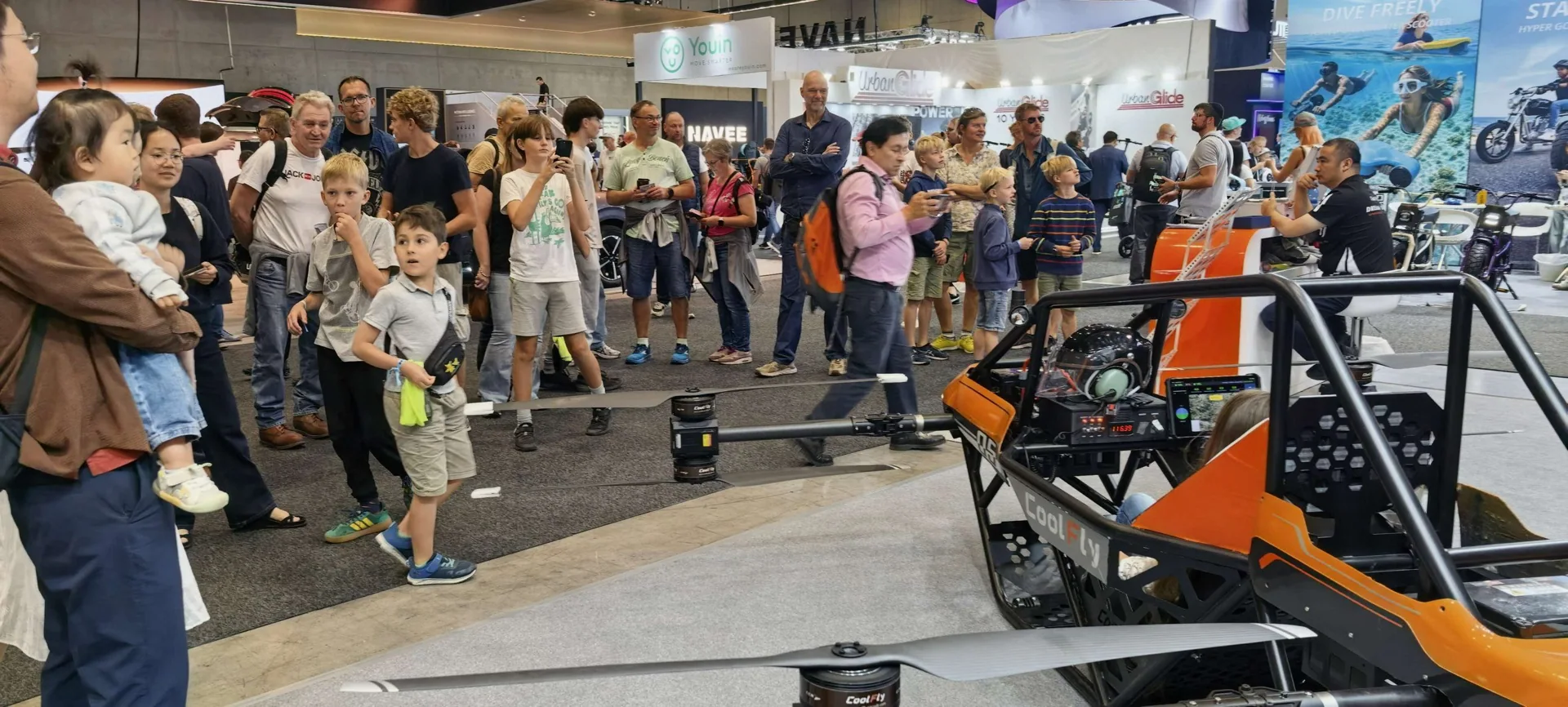 A crowd gathered in front of the CoolFly booth